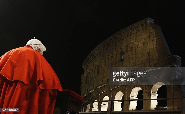 Pope Benedict XVI prays during the Way of the Cross on Good Friday on April 2, 2010 at Rome's Colosseum. AFP PHOTO / POOL / MAX ROSSI