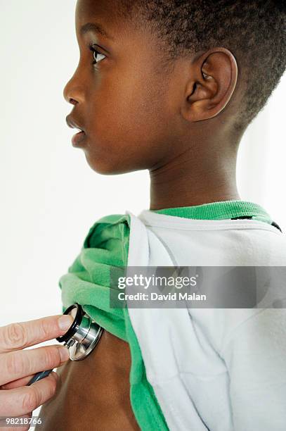 boy with stethoscope being held on chest, cape town, western cape province, south africa - western cape province stock-fotos und bilder