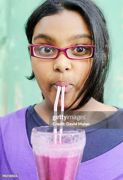 girl wearing pink glasses, sipping pink smoothie, cape town, western cape province, south africa - western cape province stock-fotos und bilder