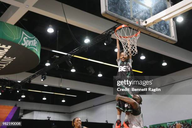 The Game helps Miles Brown dunk at the Celebrity Basketball Game Sponsored By Sprite during the 2018 BET Experience at Los Angeles Convention Center...