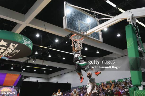 The Game helps Miles Brown dunk at the Celebrity Basketball Game Sponsored By Sprite during the 2018 BET Experience at Los Angeles Convention Center...