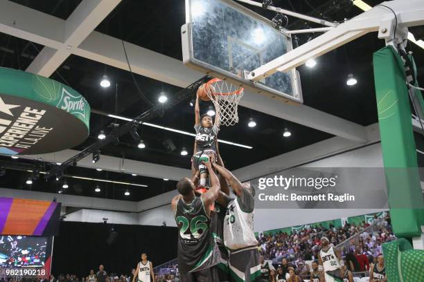 Doug Christine and The Game help Miles Brown dunk at the Celebrity Basketball Game Sponsored By Sprite during the 2018 BET Experience at Los Angeles...