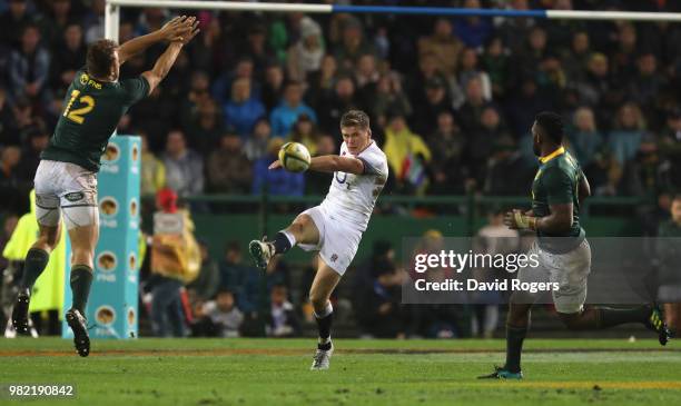 Owen Farrell of England kicks the ball upfield during the third test match between South Africa and England at Newlands Stadium on June 23, 2018 in...