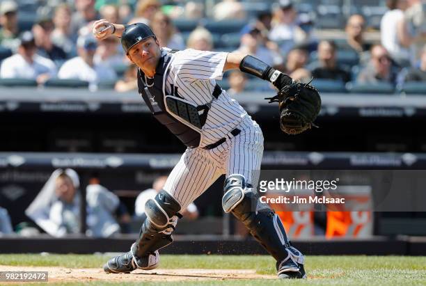 Austin Romine of the New York Yankees in action against the Seattle Mariners at Yankee Stadium on June 21, 2018 in the Bronx borough of New York...