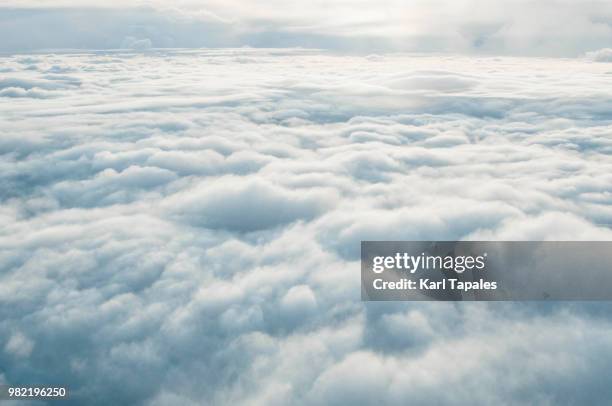 airplane window cloudscape - cotton cloud stock pictures, royalty-free photos & images