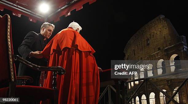 Pope Benedict XVI is helped by his personal secretary Georg Gaenswein during the Way of the Cross on Good Friday on April 2, 2010 at Rome's...