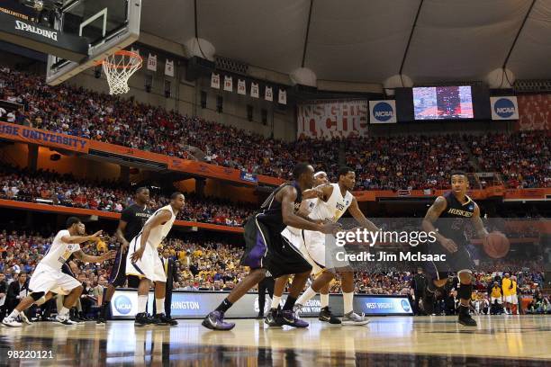 Isaiah Thomas of the Washington Huskies dribbles the ball against the West Virginia Mountaineers during the east regional semifinal of the 2010 NCAA...