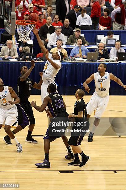 Kevin Jones of the West Virginia Mountaineers reaches for a rebound against the Washington Huskies during the east regional semifinal of the 2010...