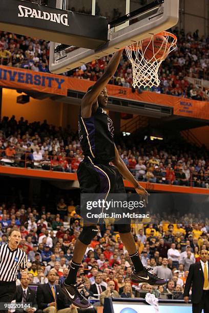 Justin Holiday of the Washington Huskies dunks against the West Virginia Mountaineers during the east regional semifinal of the 2010 NCAA men's...