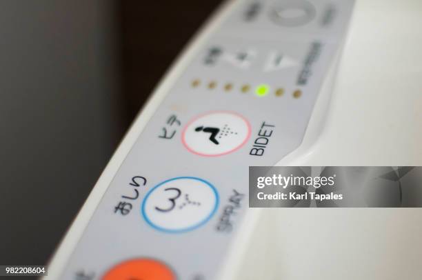 a bidet sign on the toilet - bidé fotografías e imágenes de stock