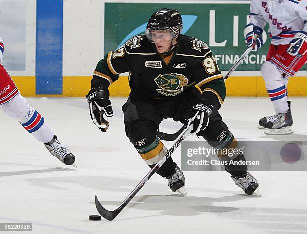 Jared Knight of the London Knights skates with the puck in the first game of the second round of the 2010 playoffs against the Kitchener Rangers on...