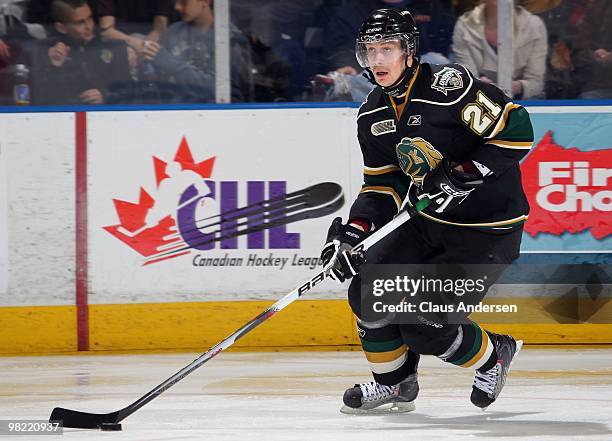 Kalle Ekelund of the London Knights skates with the puck in the first game of the second round of the 2010 playoffs against the Kitchener Rangers on...