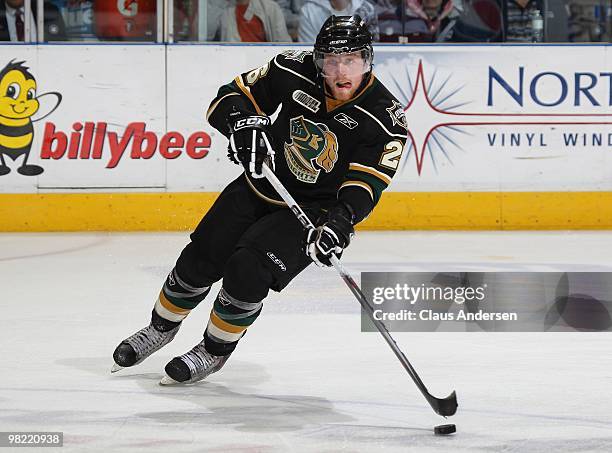 Colin Martin of the London Knights skates with the puck in the first game of the second round of the 2010 playoffs against the Kitchener Rangers on...