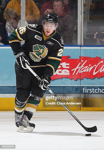 Colin Martin of the London Knights skates with the puck in the first game of the second round of the 2010 playoffs against the Kitchener Rangers on...