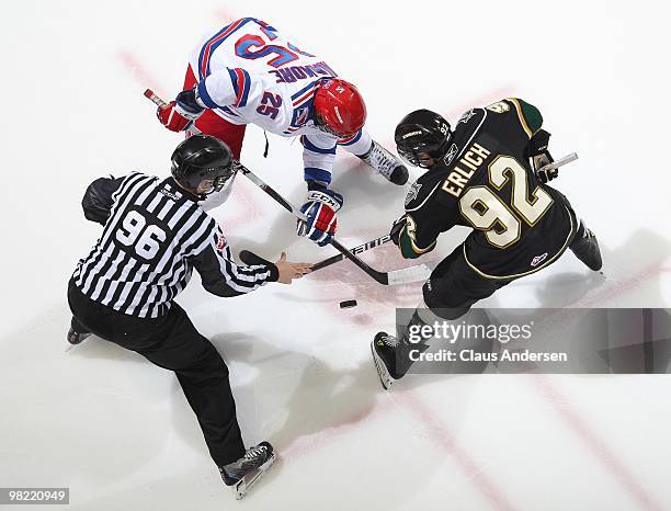 Julian Cimadamore of the Kitchener Rangers takes a faceoff against Daniel Erlich of the London Knights in the first game of the second round of the...