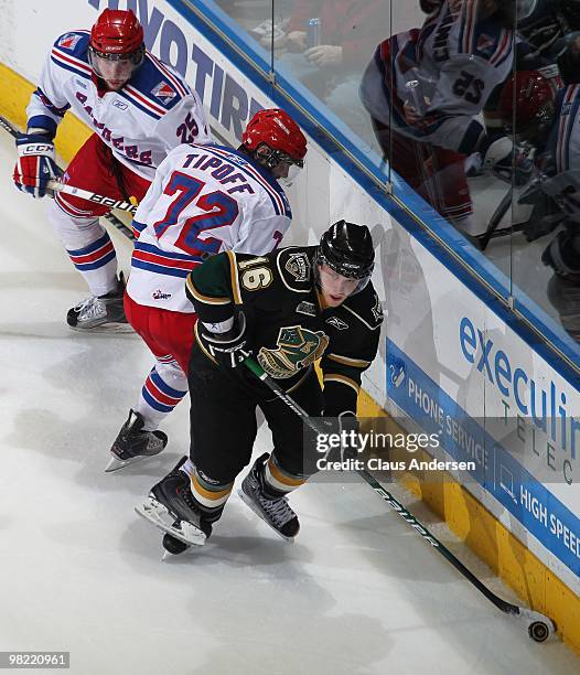 Tyler Brown of the London Knights comes away with the loose puck in the first game of the second round of the 2010 playoffs against the Kitchener...