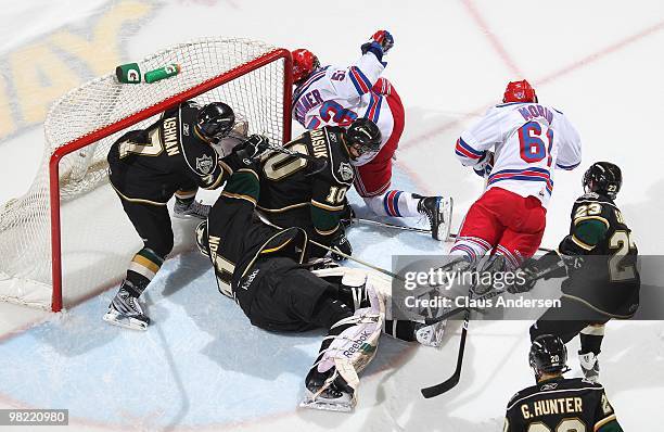 Jeff Skinner and Jeremy Morin of the Kitchener Rangers encounter heavy hitting in front of Michael Hutchinson of the London Knights in the first game...