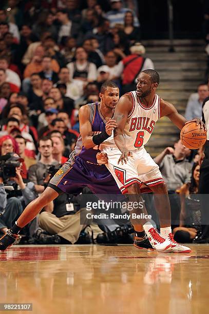 Ronald Murray of the Chicago Bulls handles the ball against Leandro Barbosa of the Phoenix Suns during the game on March 30, 2010 at the United...