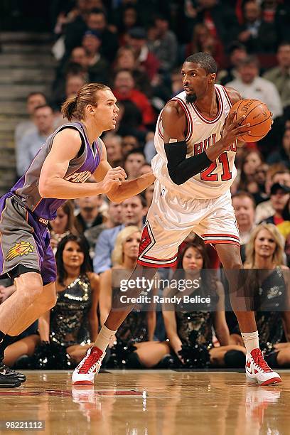 Hakim Warrick of the Chicago Bulls handles the ball against Louis Amundson of the Phoenix Suns during the game on March 30, 2010 at the United Center...