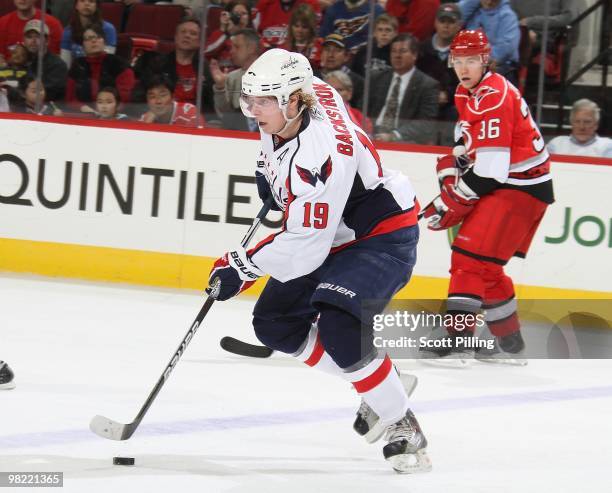 Nicklas Backstrom of the Washington Capitals skates the puck into the defensive zone of the Carolina Hurricanes during the NHL game on March 18, 2010...