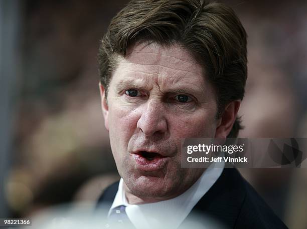 Head coach Mike Babcock of the Detroit Red Wings talks to his players on the bench during the game against the Vancouver Canucks at General Motors...