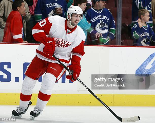 Drew Miller of the Detroit Red Wings skates up ice during the game against the Vancouver Canucks at General Motors Place on March 20, 2010 in...