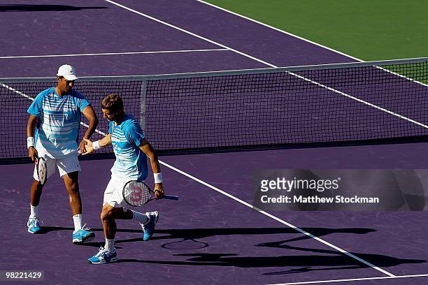 Mahesh Bhupathi of India Max and Mirnyi of Belarus celebrate a point against Mariusz Fyrstenberg and Marcin Matkowski of Poland during day eleven of...