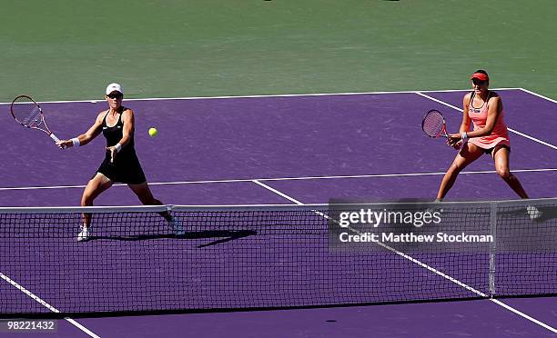 Samantha Stosur of Australia and Nadia Petrova of Russia play Yung-Jan Chan of Taipei and Jie Zheng of China during day eleven of the 2010 Sony...