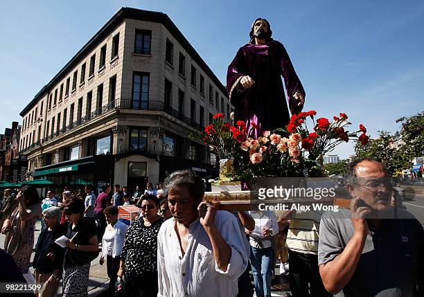 Latino Catholics carry the cross in a Via Crucis procession, also known as walk in the footsteps of Christ, on Good Friday, April 2, 2010 in...