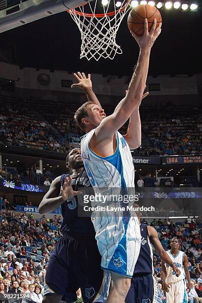 Darius Songaila of the New Orleans Hornets goes to the basket against Zach Randolph of the Memphis Grizzlies during the game on March 3, 2010 at the...