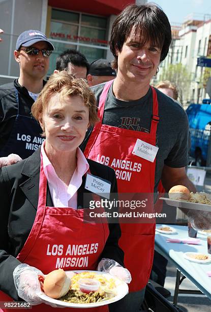 Actors Peggy McCay and Patrick Muldoon volunteer at the Los Angeles Mission during Easter on April 2, 2010 in Los Angeles, California.