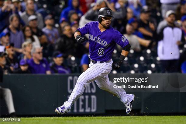 Gerardo Parra of the Colorado Rockies rounds third base to score a seventh inning run against the New York Mets at Coors Field on June 18, 2018 in...