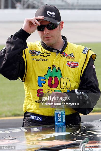 Johnny Sauter, driver of the Curb Records Chevrolet looks on during qualifying for the NASCAR Camping World Truck Series Nashville 200 at Nashville...