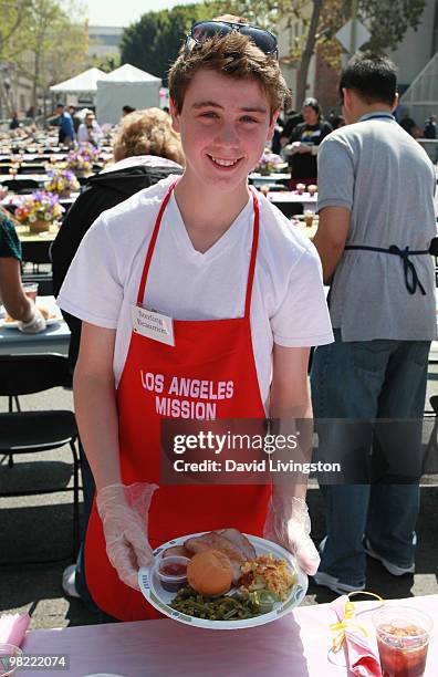 Actor Sterling Beaumon volunteers at the Los Angeles Mission during Easter on April 2, 2010 in Los Angeles, California.