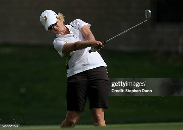 Karrie Webb of Australia hits her second shot on the 15th hole during the second round of the Kraft Nabisco Championship at Mission Hills Country...