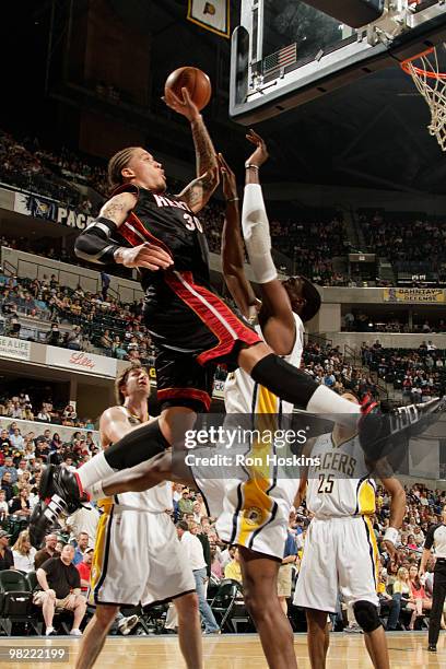 Michael Beasley of the Miami Heat shoots over Roy Hibbert of the Indiana Pacers at Conseco Fieldhouse on April 2, 2010 in Indianapolis, Indiana. NOTE...