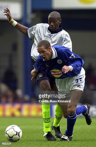Junior Lewis of Leicester is challenged by Paulo Wanchope of Man City during the FA Carling Premiership match between Leicester City v Manchester...