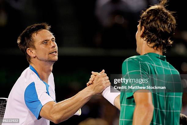 Robin Soderling of Sweden congratulates Tomas Berdych of the Czech Republic during day eleven of the 2010 Sony Ericsson Open at Crandon Park Tennis...