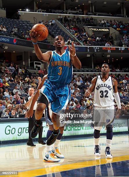 Chris Paul of the New Orleans Hornets drives for a layup against O.J. Mayo of the Memphis Grizzlies on April 02, 2010 at FedExForum in Memphis,...
