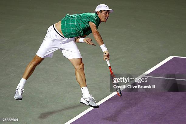 Tomas Berdych of the Czech Republic serves to Robin Soderling of Sweden during day eleven of the 2010 Sony Ericsson Open at Crandon Park Tennis...