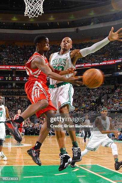 Aaron Brooks of the Houston Rockets makes a pass in the lane against Ray Allen of the Boston Celtics on April 2, 2010 at the TD Garden in Boston,...