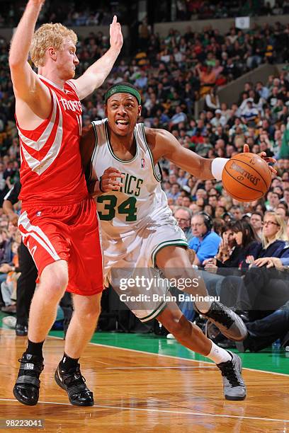 Paul Pierce of the Boston Celtics drives to the basket against Chase Budinger of the Houston Rockets on April 2, 2010 at the TD Garden in Boston,...