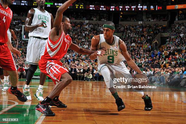 Rajon Rondo of the Boston Celtics makes a move to the basket against Aaron Brooks of the Houston Rockets on April 2, 2010 at the TD Garden in Boston,...