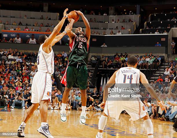 Stephen Graham of the Charlotte Bobcats blocks against John Salmons of the Milwaukee Bucks on April 2, 2010 at the Time Warner Cable Arena in...