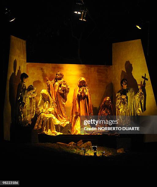 Paraguayan artists make a tableau vivant of the birth of Jesus Christ, in Misiones, a city some 225 km south of Asuncion, during Good Friday...