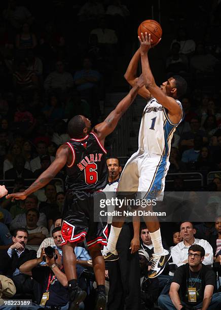 Nick Young of the Washington Wizards shoots against Ronald Murray of the Chicago Bulls at the Verizon Center on April 2, 2010 in Washington, DC. NOTE...