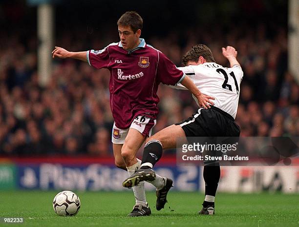 Joe Cole of West Ham gets away from Danny Higginbotham of Derby during the FA Carling Premiership game between West Ham United and Derby County at...
