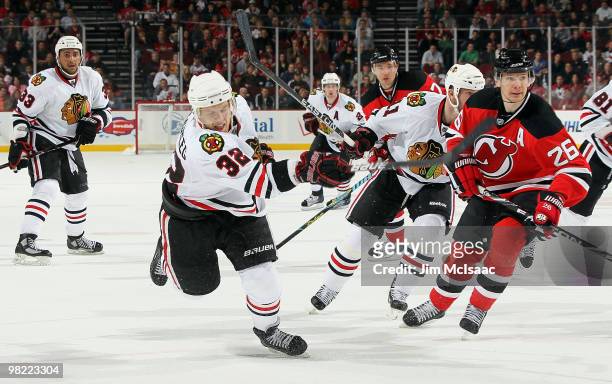 Kris Versteeg of the Chicago Blackhawks fires the puck for the game tying goal past Patrik Elias of the New Jersey Devils with 26 seconds left in the...