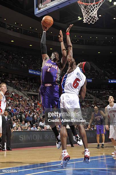 Amar'e Stoudemire of the Phoenix Suns goes up for a shot against Ben Wallace of the Detroit Pistons in a game at the Palace of Auburn Hills on April...