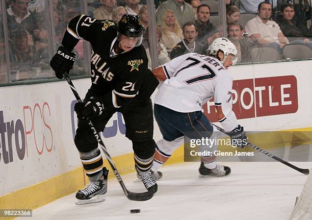 Loui Eriksson of the Dallas Stars skates away from Tom Gilbert of the Edmonton Oilers on April 2, 2010 at the American Airlines Center in Dallas,...